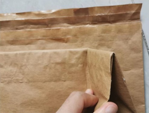 Open mouth of a pinch-bottom paper bag